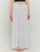 Model front view of long white and black floral skirt