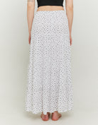 Model back view of long floral skirt