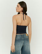 Woman wearing a black halter top - Back view