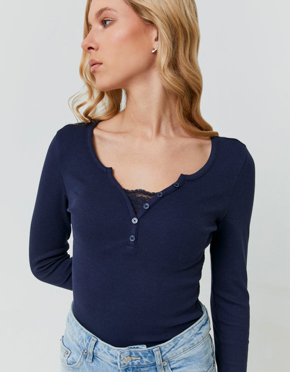 Tally Weijl blue long sleeve T-shirt with lace detail and button neckline, worn by model