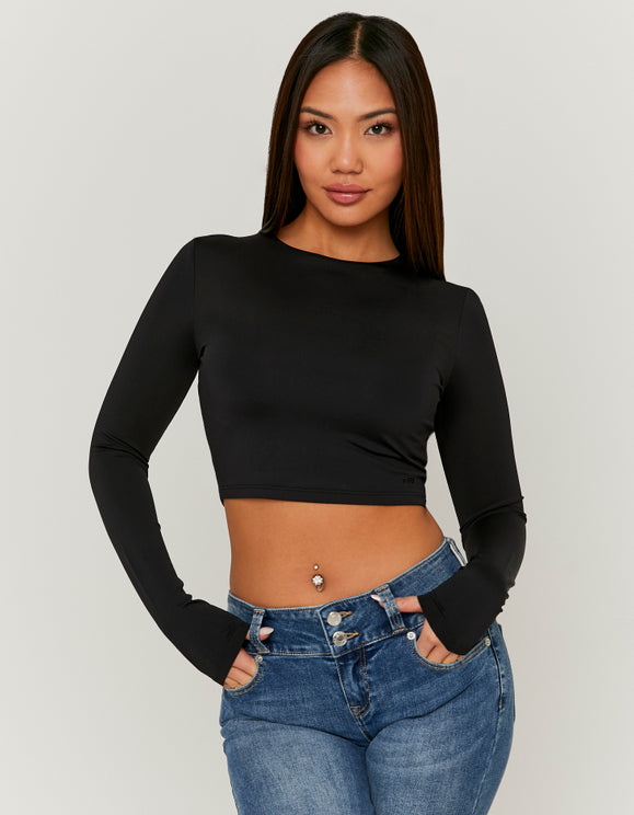 Tally Weijl black long sleeve cropped T-shirt worn by model, front view