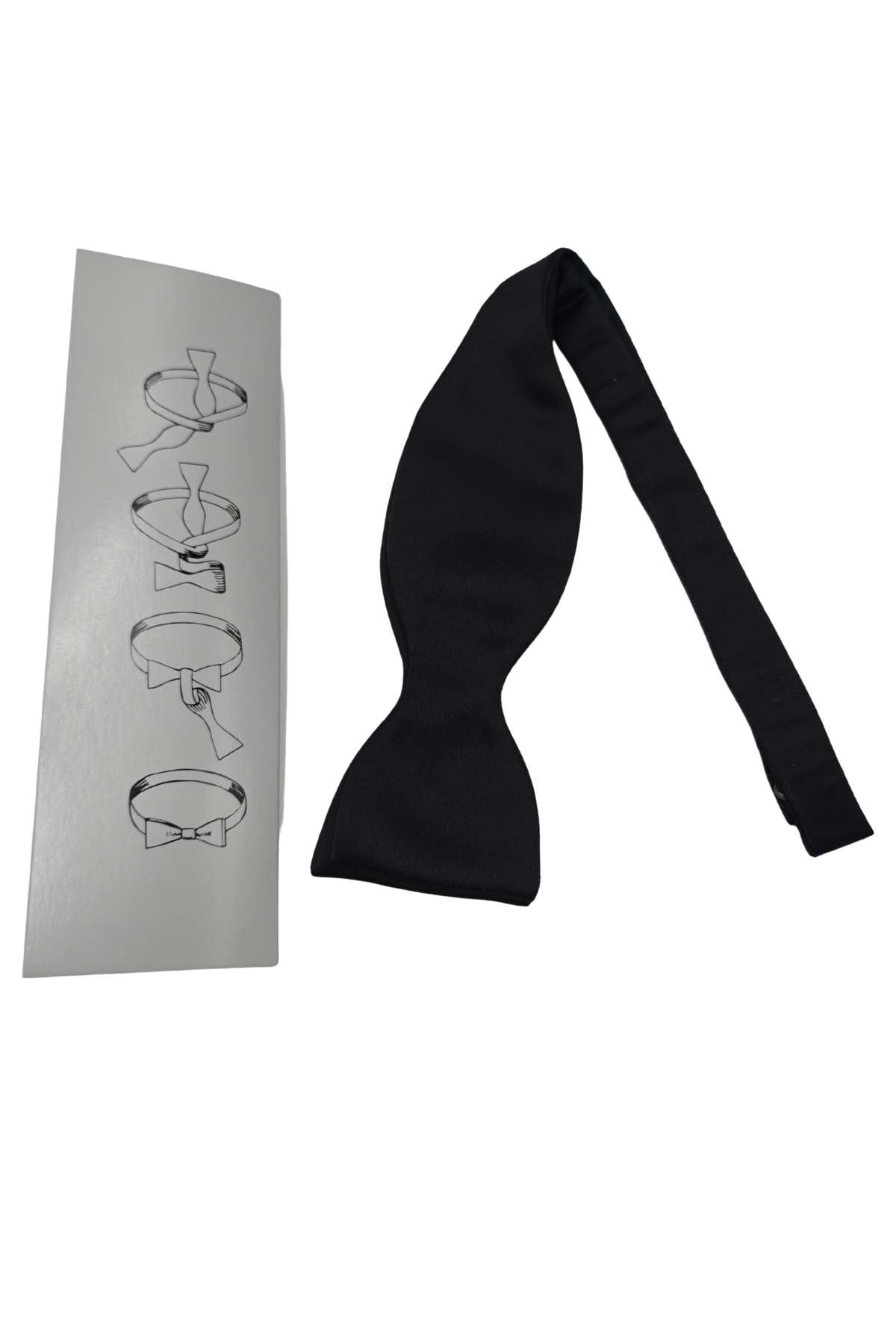 Black bow tie on a white background with a branded box.
