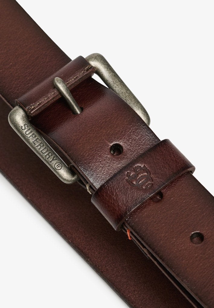 Brown leather belt with brass buckle on a white background