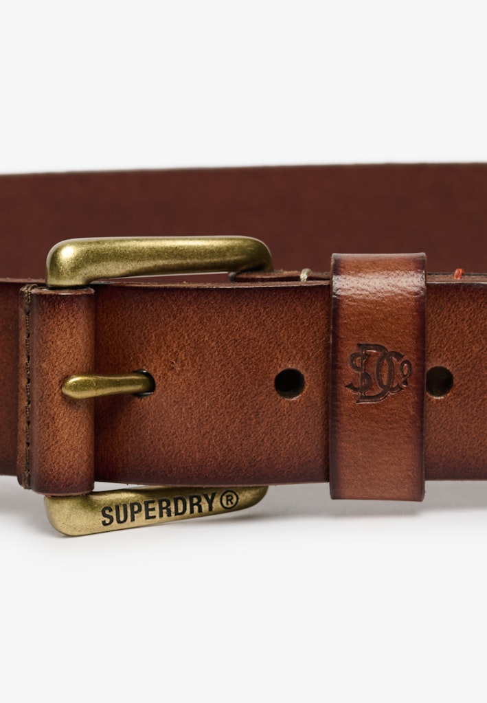Tan leather belt with brass buckle on a white background