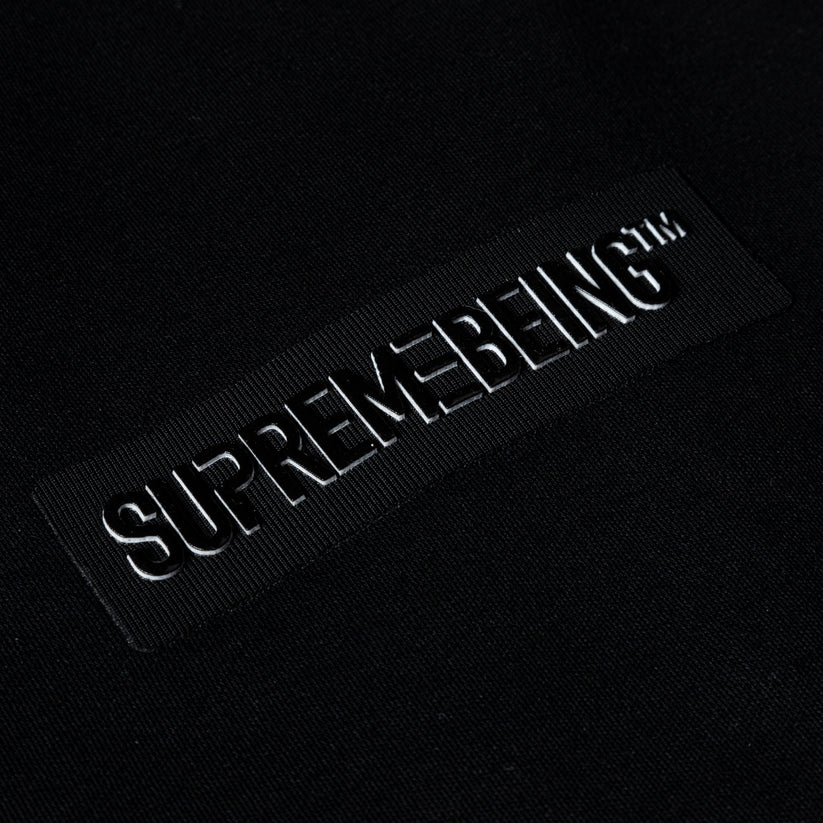 Black patch with 'SUPREMEBEING' text on a black background