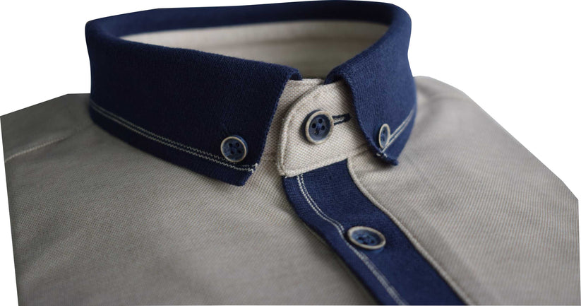 Close-up of a Tom Penn beige melange polo shirt with a navy blue collar and buttons on a white background