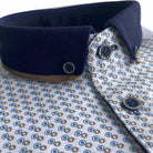 Close-up of Tom Penn white polo shirt with blue and taupe micro print, navy button-down collar and button placket
