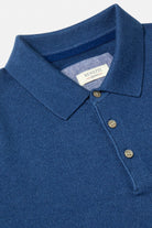 Close-up of the Benetti Trevor Indigo Polo showing the collar, button placket and woven logo label.