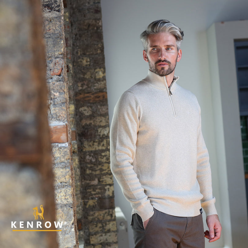 Man wearing a Hhalf-zip Sand Melange Knit looking right