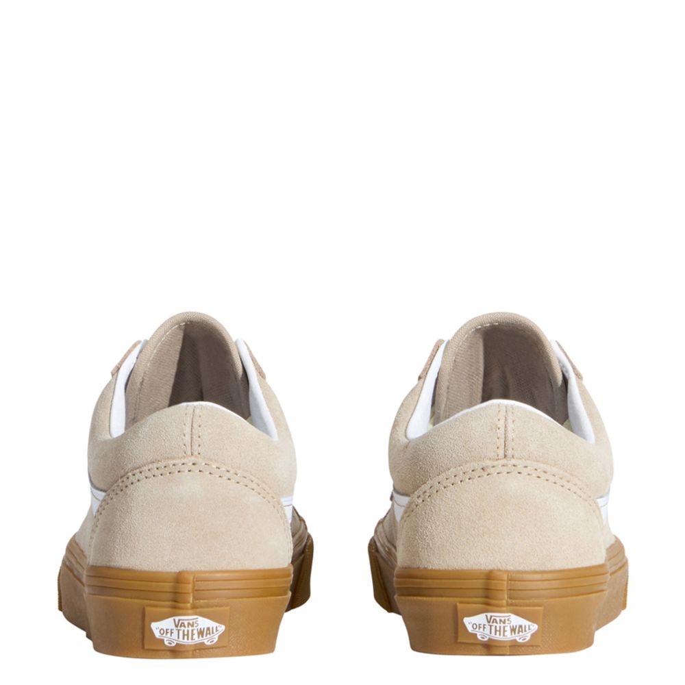 Beige sneakers with brown soles on a white background