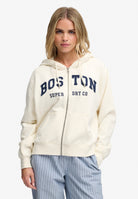 Superdry Ath Essential Relaxed Crop Ziphood in Desert Bone Off White on model