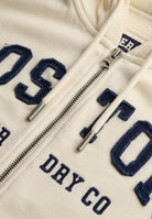 Superdry Ath Essential Relaxed Crop Ziphood in Desert Bone Off White zip and logo detail