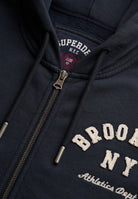 Superdry Ath Essential Relaxed Crop Ziphood in Eclipse Navy zip and logo detail
