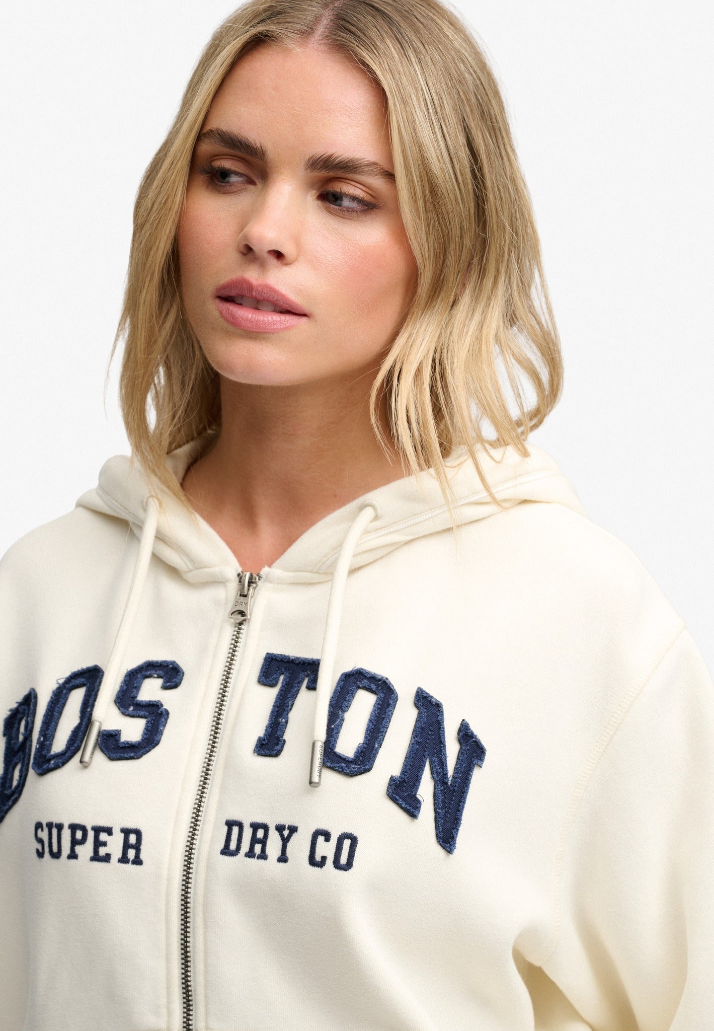 Superdry Ath Essential Relaxed Crop Ziphood in Desert Bone Off White upper body view