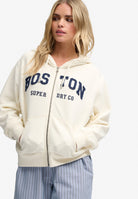 Superdry Ath Essential Relaxed Crop Ziphood in Desert Bone Off White on model angled view