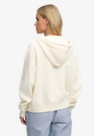 Superdry Ath Essential Relaxed Crop Ziphood in Desert Bone Off White back view on model