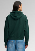 Superdry Ath Essential Applique Crop Hood in Enamel Green back view on model