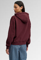 Superdry Ath Essential Applique Crop Hood in Port Red back view on model