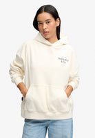 Superdry Drop Needle Velour Hoodie in Cream on model