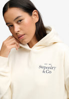 Superdry logo embroidery detail on Drop Needle Velour Hoodie in Cream