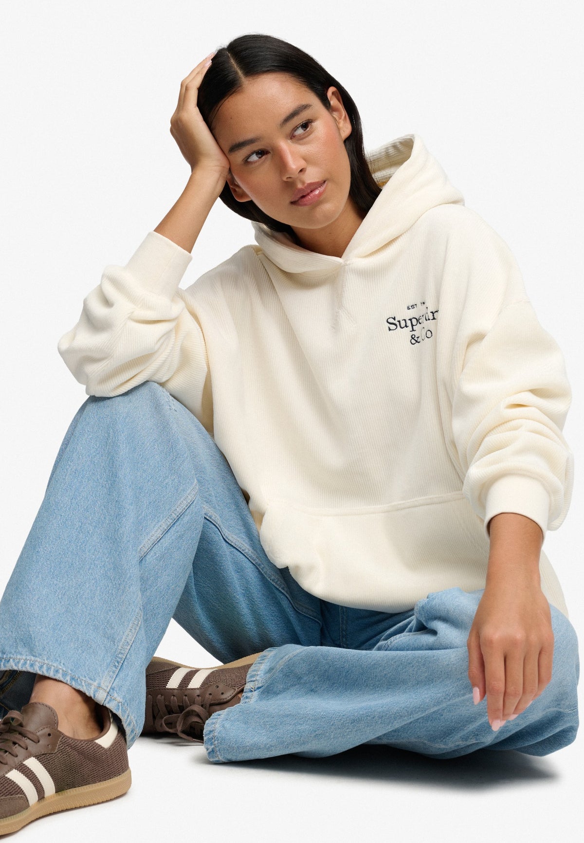 Seated view of Superdry Drop Needle Velour Hoodie in Cream
