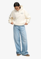 Full length view of Superdry Drop Needle Velour Hoodie in Cream