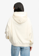 Back view of Superdry Drop Needle Velour Hoodie in Cream on model