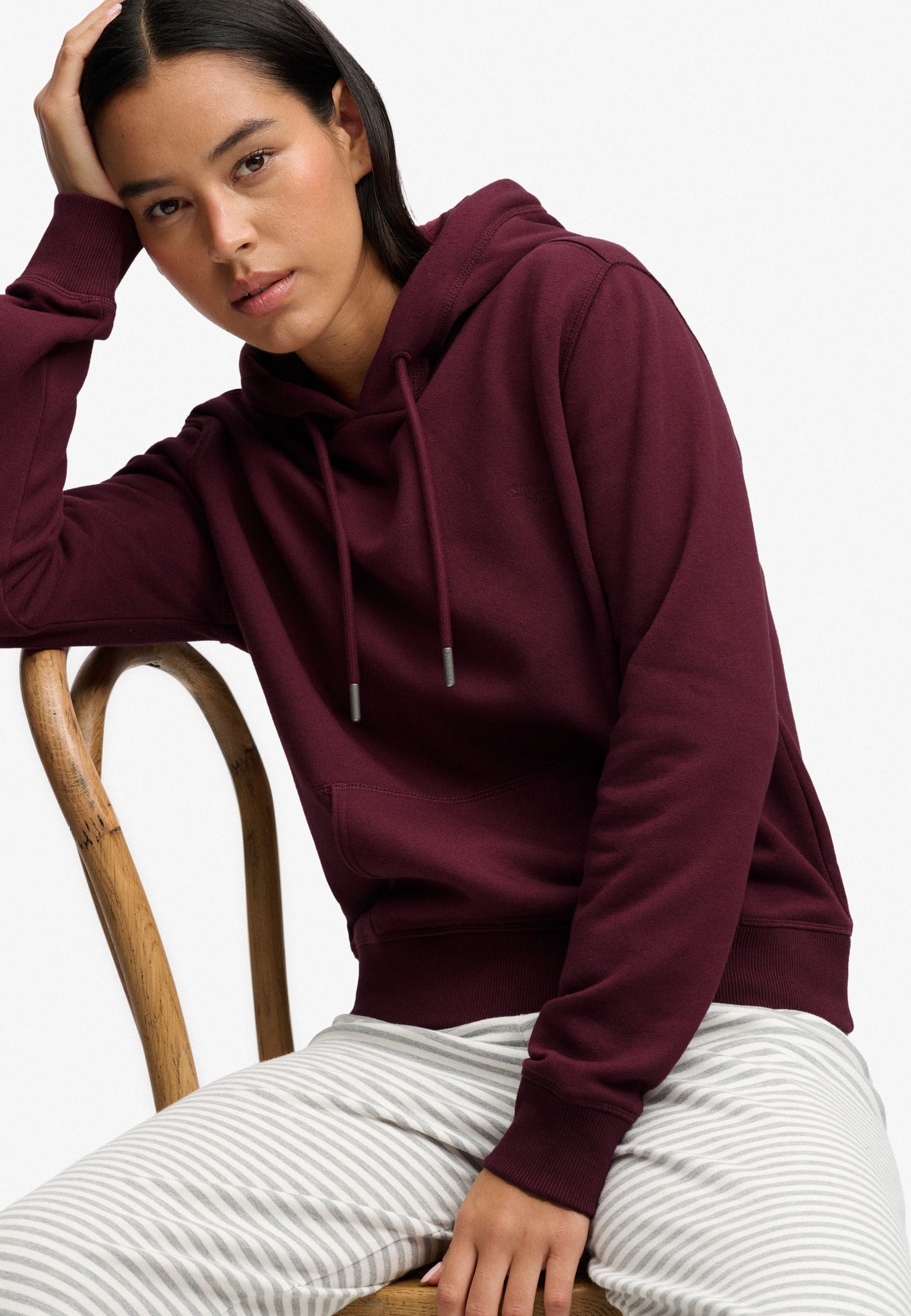 Superdry Signature Embroidered Hood in Port Red seated model view