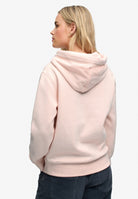 Back view of Superdry Signature Embroidered Hoodie in Rose Blush Pink on model
