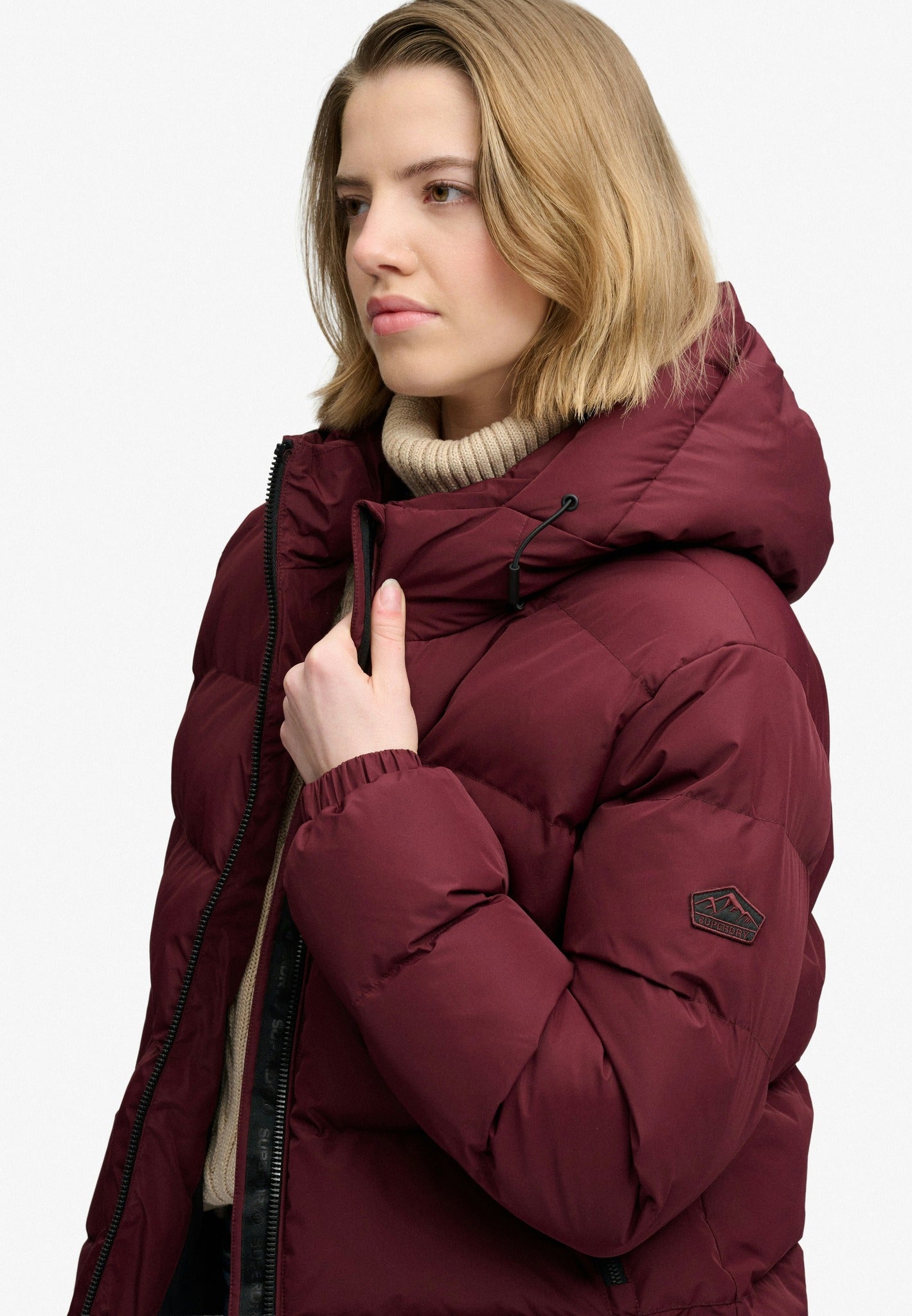 Superdry Hooded Sports Puffer Jacket in Port Red angled model view