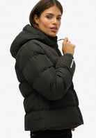 Superdry Hooded Sports Puffer Jacket in Black angled model view