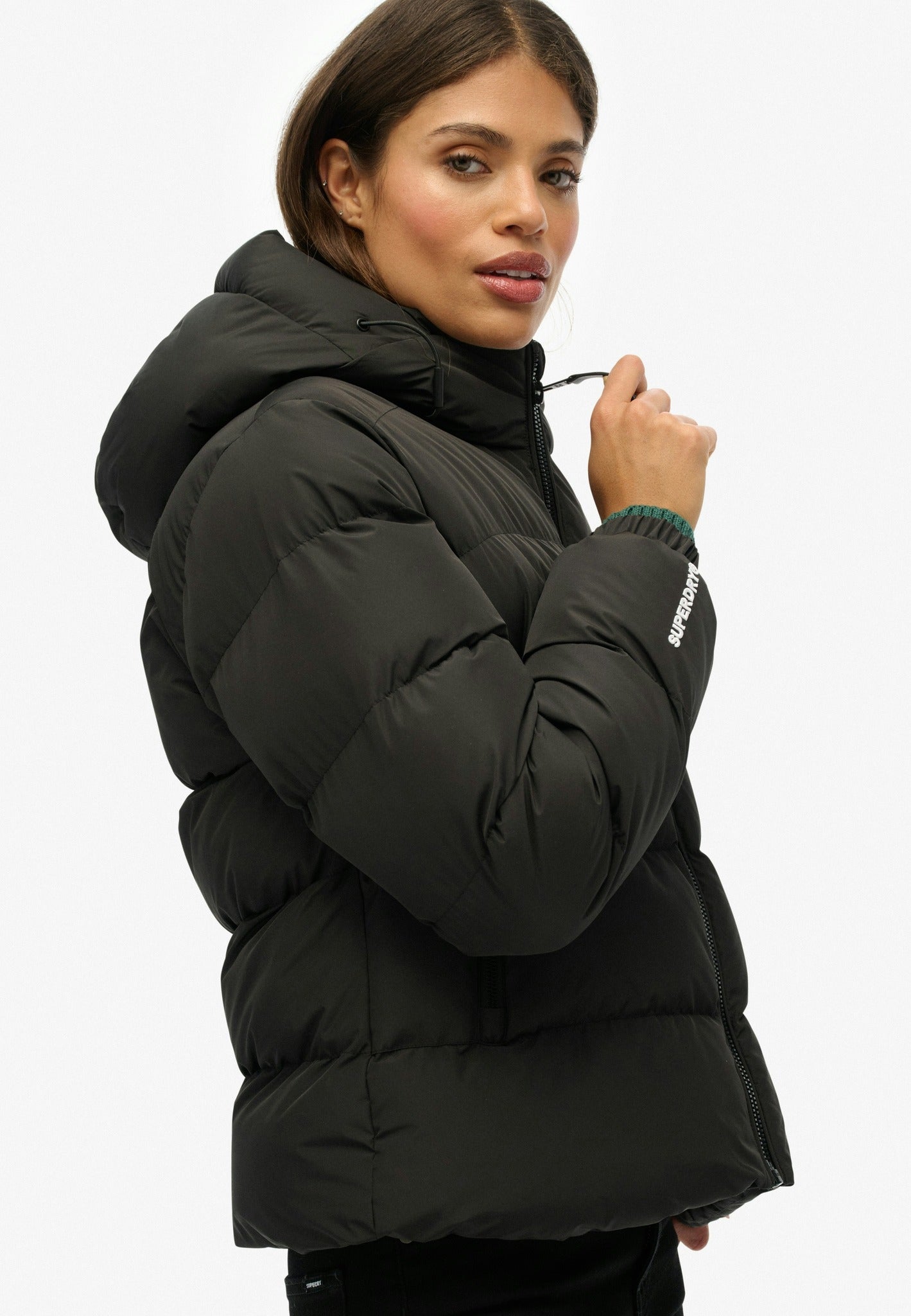 Superdry Hooded Sports Puffer Jacket in Black angled model view