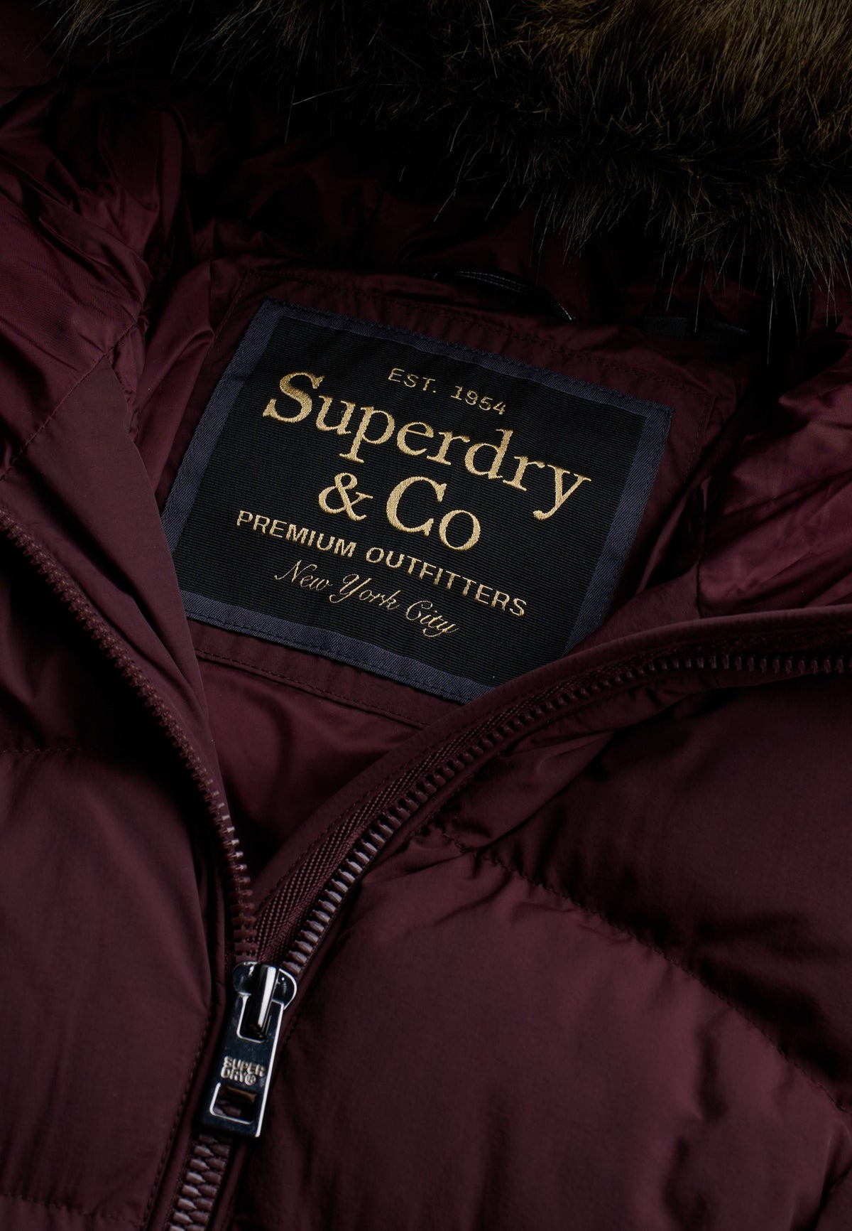 Superdry Hood Faux Fur Fuji Mid Length Jacket in Dark Oxblood branded label and zip detail
