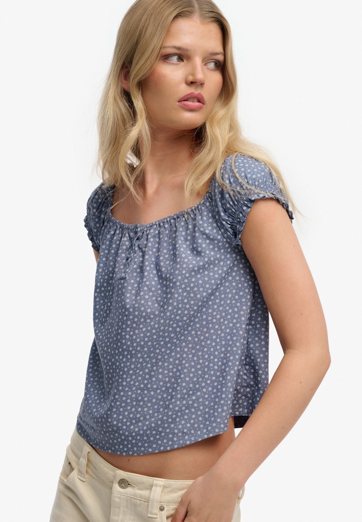 Side view of the Superdry Short Sleeve 1 2 Button Woven Top