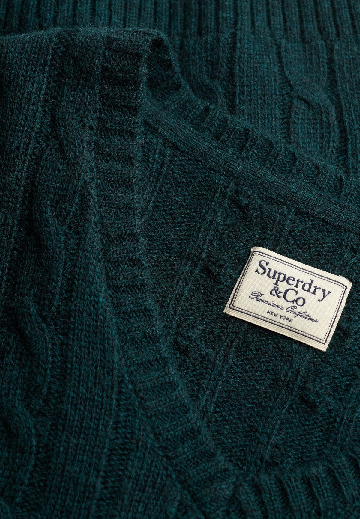 Superdry Wool Blend Cable V Neck in Pine Green Marl cable knit texture and brand label detail