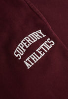 Superdry Athletic Embroidered Flare Jogger in Port Red embroidered logo detail