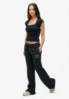 Superdry Athletic Print Flare Jogger in Eclipse Navy angled model view