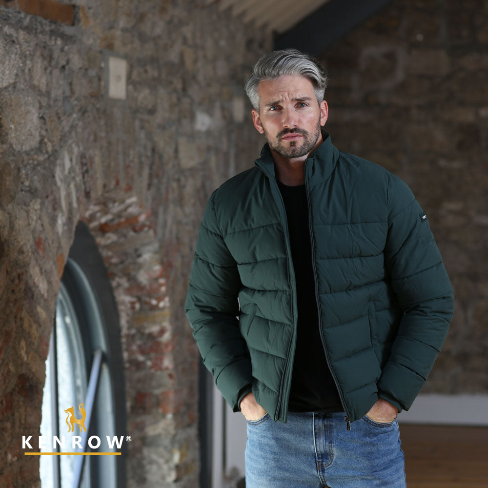 Man wearing a dark olive puffer jacket