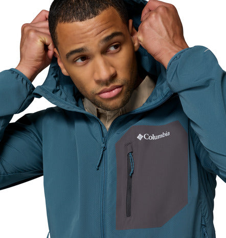 Man wearing a blue Columbia jacket on a white background