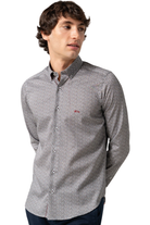 Man wearing a patterned burgundy and navy shirt on a white background