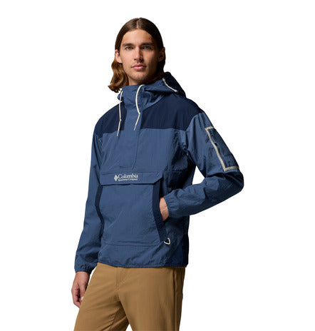 Person wearing a blue Columbia jacket on a white background