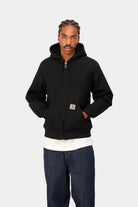 Model wearing the Carhartt WIP Active Jacket in Black Rigid, zipped front view