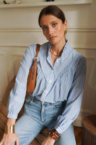Women's blue and white fine striped shirt front model view
