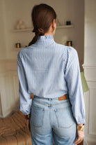Women's blue and white fine striped shirt back model view