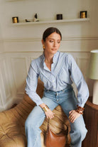 Women's blue and white fine striped shirt sleeve detail