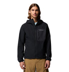 Person wearing a black Columbia jacket on a white background