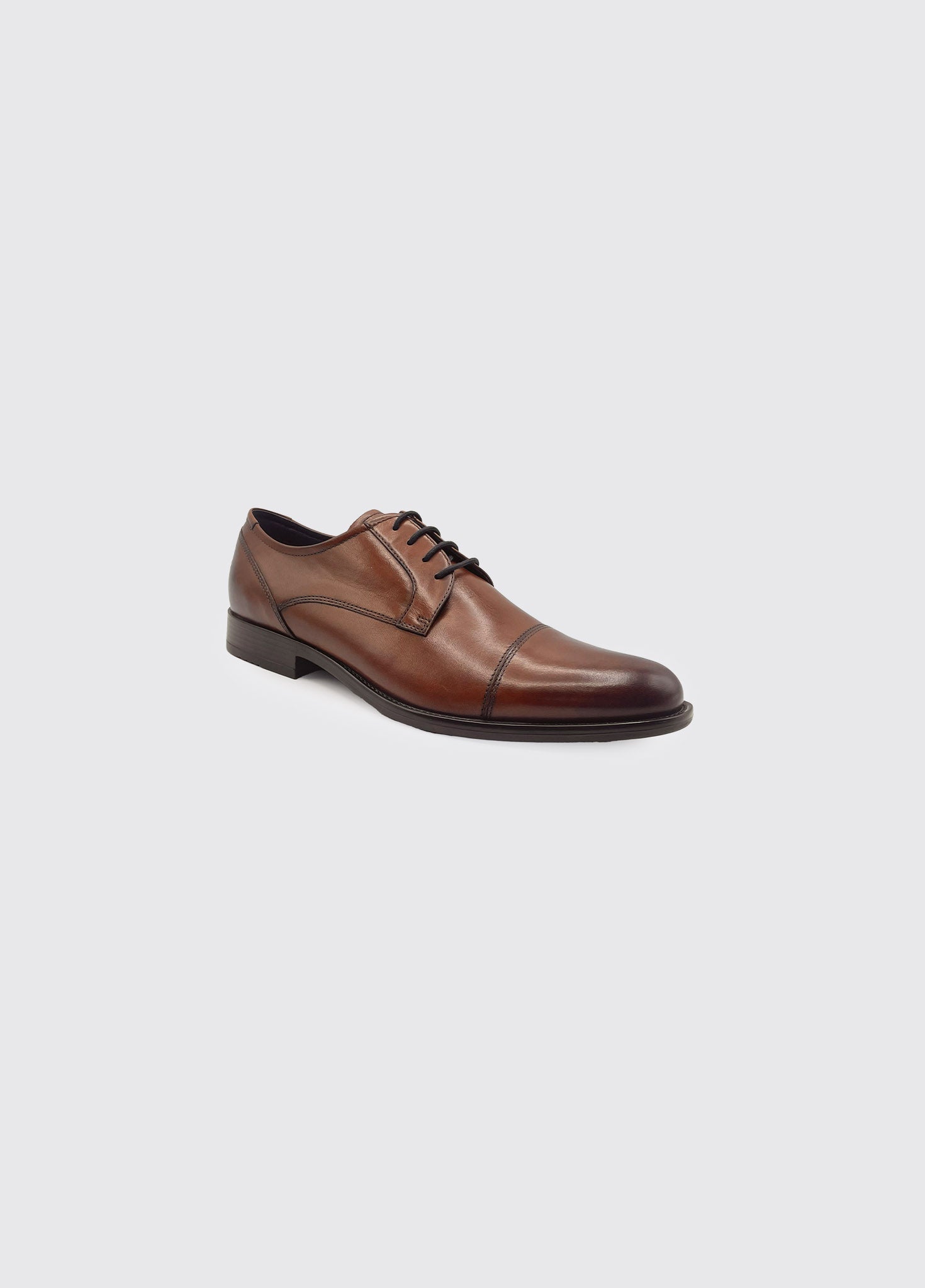 Derek whiskey leather dress shoe on a light gray background