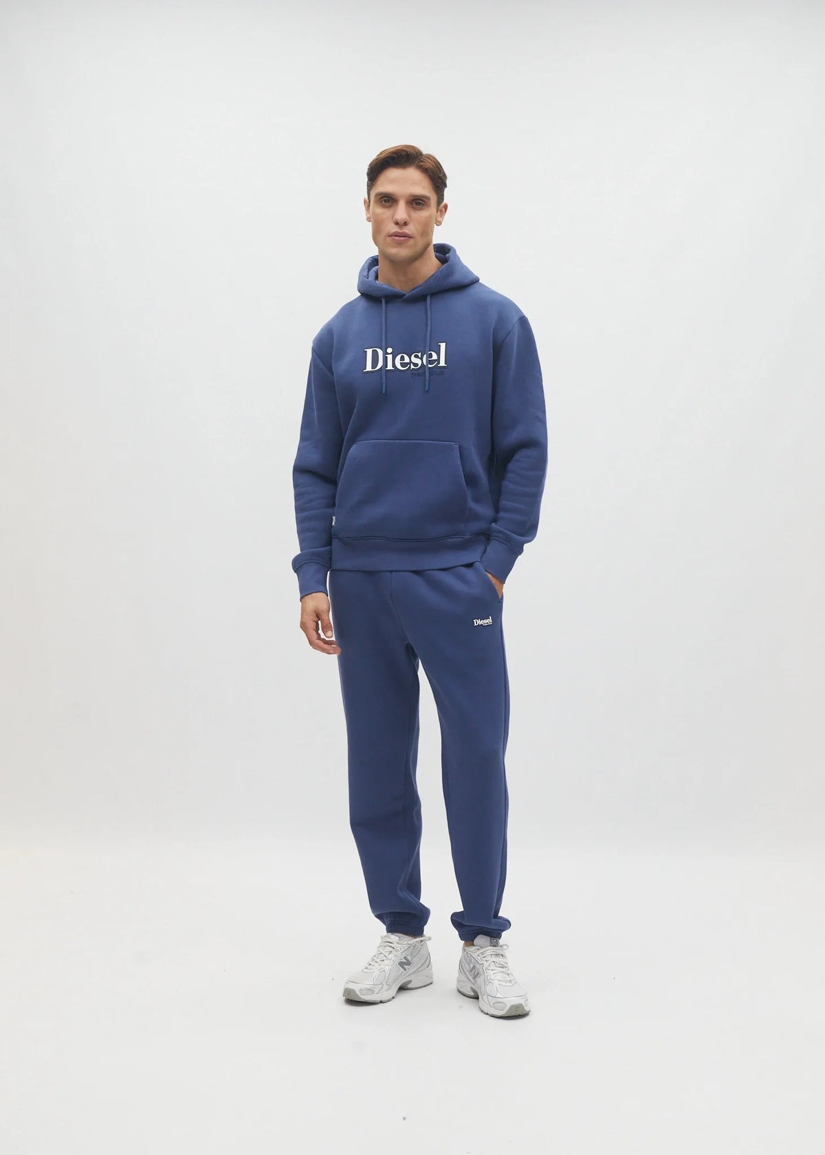 Diesel Walt Hoodie in Hugo Blue, front model view showing the chest graphic and kangaroo pocket.