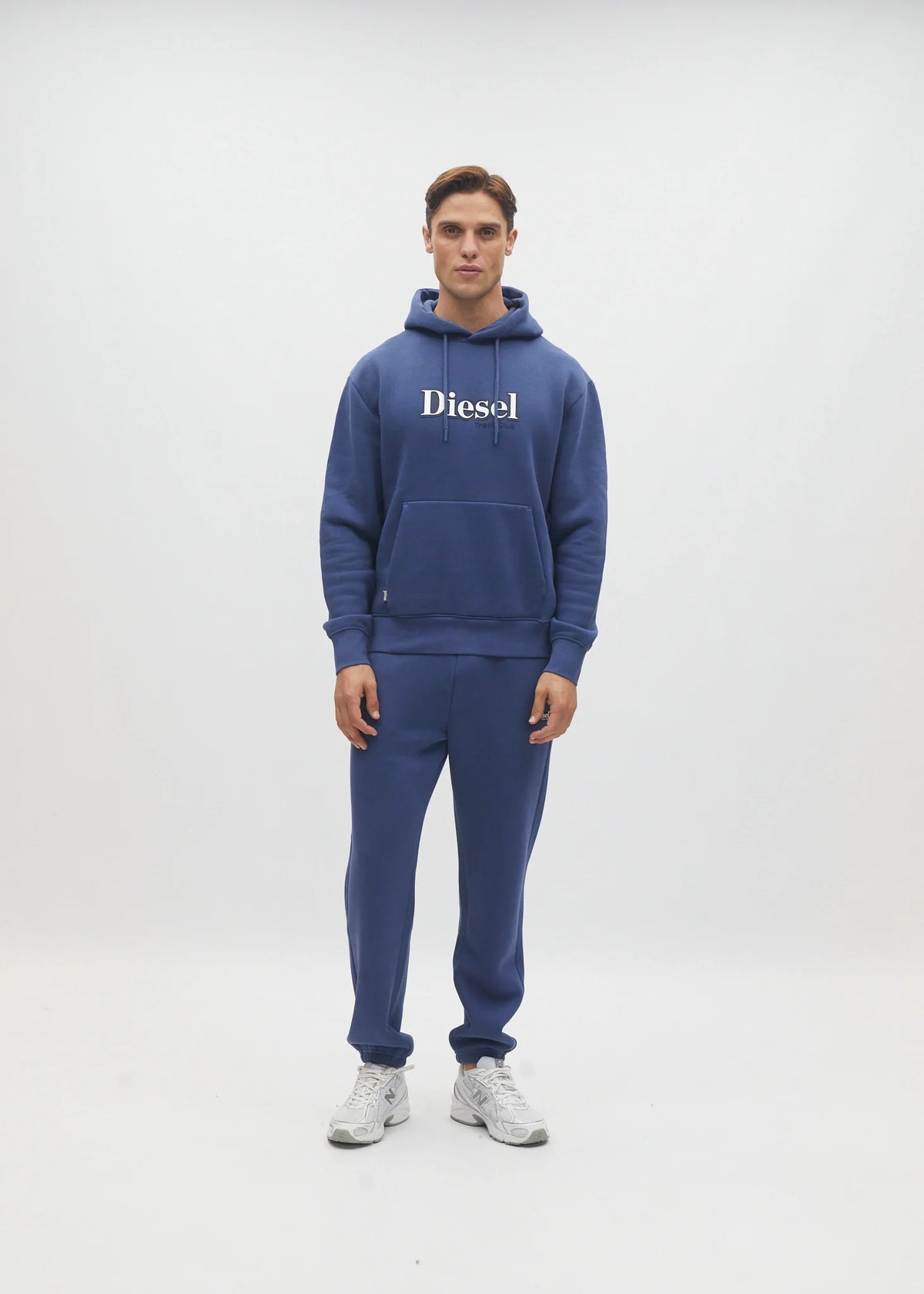 Diesel Walt Hoodie in Hugo Blue, straight front model view showing the drawstring hood and ribbed hem.