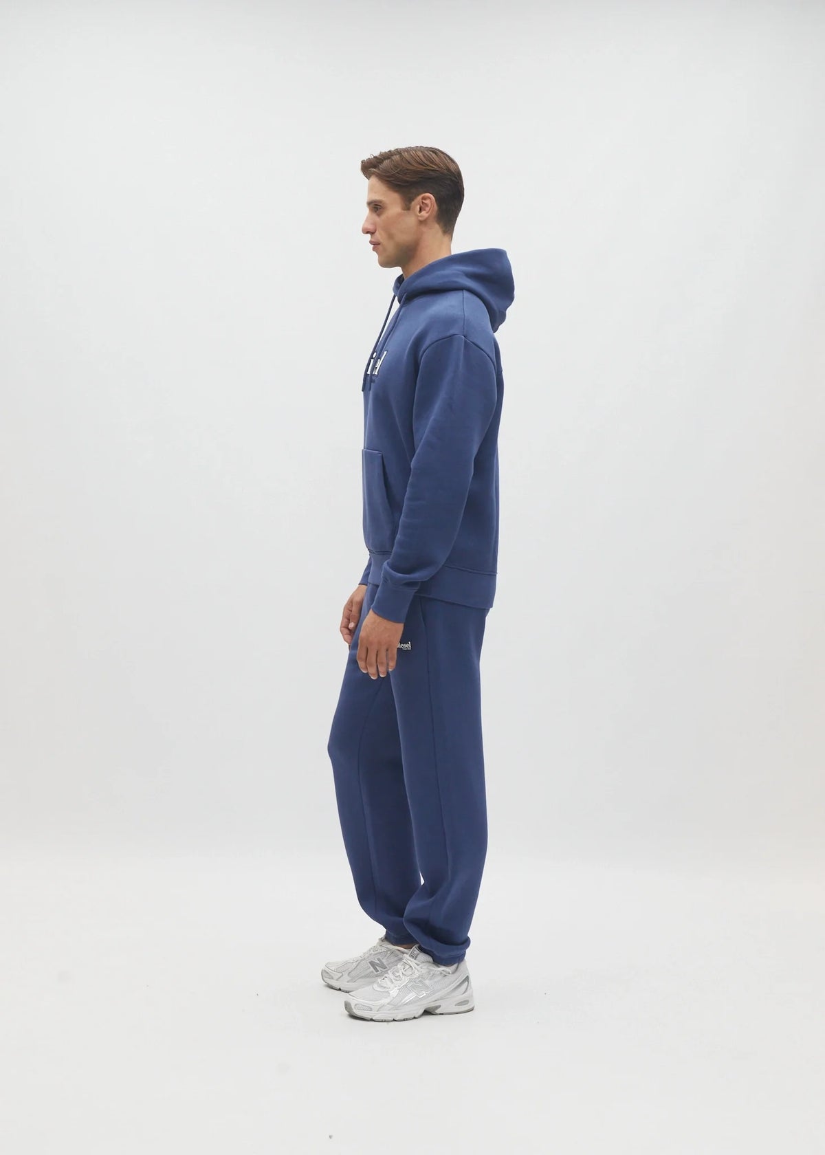 Diesel Walt Hoodie in Hugo Blue, side model view showing the hood and sleeve.
